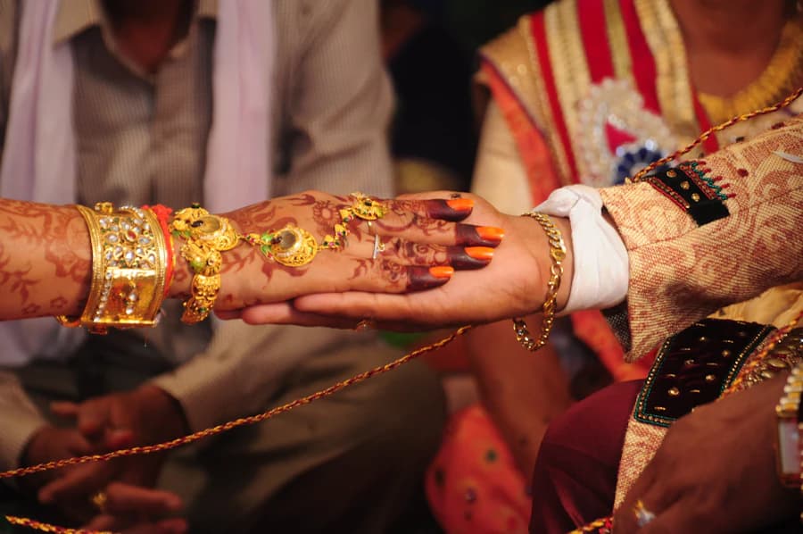 Two hands joined during a wedding ritual